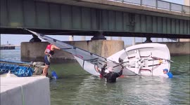 Sailors walk under Kent's Kingsferry Bridge, UK
