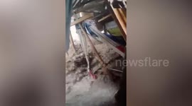 Wooden hut collapses in Typhoon Haikui floods in the Philippines
