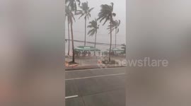 Tourists take shelter as Typhoon Haikui batters holiday island in the Philippines