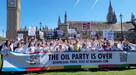 Chris Packham and scientists protest against new oil contracts at Parliament Square.
