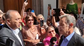 Former French president Nicolas Sarkozy jeered in Paris during bookshop visit following pro-Russia comments