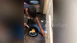 Youngster drops eggs in amusing frying pan cooking fail