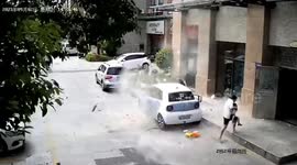 Mother and child narrowly escape falling bricks in China
