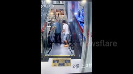 Quick-thinking man rescues elderly and child from wrong-way escalator mishap