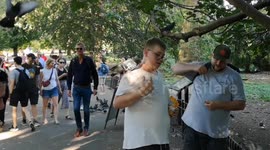 Pigeons and Parakeets interacting with tourists in St Jane's park