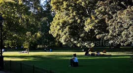 People enjoying the hot sunny summer day in St James Park