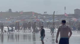 Americans flock to beaches amid record heat