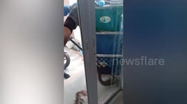 Large python hiding behind boxes in family's garage caught