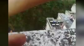 Hero policeman handcuffs himself to man trying to jump from building in China