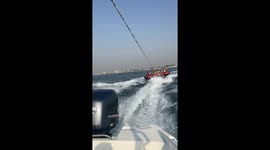 Tubers launches into air following collision with wave
