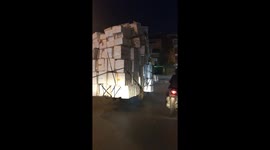 Health and safety? Motorist rides ridiculously overloaded 3-wheeler along busy Hanoi road