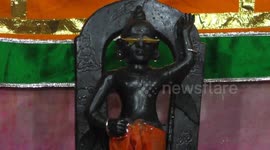 Bathing ceremony of Hindu Lord Krishna on Janmashtami Festival in India