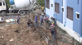 Great teamwork on a small building construction site in Thailand.