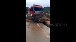 Two firefighters dead as rescue truck overwhelmed by raging floodwaters in China