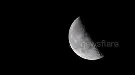 HD footage shows the International Space Station racing across sky in front of the Moon