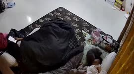 Crazed pet cat attacks baby's head as he sleeps on bed