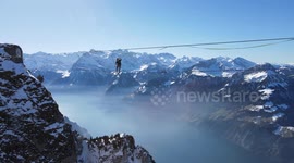 Mountain aerial slacklining: suspended lady's stunning maneuvers