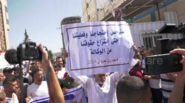 Palestinian owners of houses which were destroyed during the Israeli war of 2014, take part in a protest demanding for reconstruction of their houses