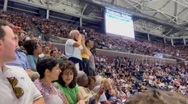 Crowd boos climate protesters who glued feet to floor, disrupting US Open semi-final