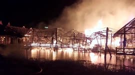 Fire crews battle flames engulfing tourist market in Thailand