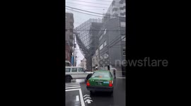 Scaffolding peeled off buildings in Tokyo by Tropical Storm Yun-Yueng