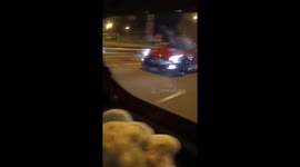 Red Nissan GT-R R35 kicks up dust on highway in Malaysia