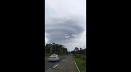 UFO cloud formation hovers over homes in the Philippines