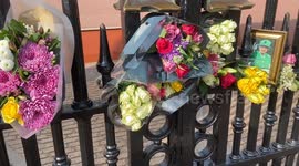 Flowers and tributes left outside Buckingham Palace as huge crowds gather on first anniversary of the Queen’s death