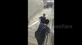 Floodwater surges down train station steps as Typhoon Haikui unleashes historic downpour on China