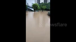 Train station in southern China swamped by record rains brought by typhoon Haikui