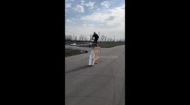 Thrilling stunt: daredevil biker defies gravity as three cars topple wooden structure!