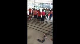 People participate in bamboo jumping dance at high speed