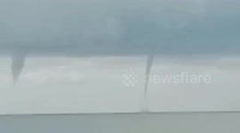 Gigantic waterspout tornado sparks panic as it forms at sea in the Philippines