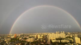 Rain gives way to sun and double rainbow shines over Bangkok
