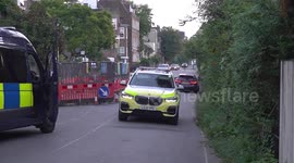 Police officers search a location in Chiswick, UK as the hunt for Daniel Khalife continues