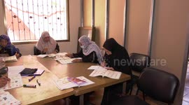 Elderly Palestinian women learn a literacy class on the International Literacy Day at the aged Care Association, in Gaza city
