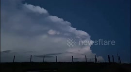 Lightning striking out back edge of severe thunderstorm in Welsh mountains