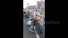 Pilot injured after glider malfunctions and crashes on bridge in China