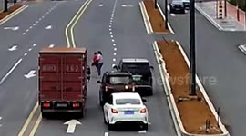 Chinese couple from truck perform heroic rescue during toddler's toy car adventure in busy traffic
