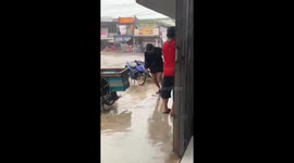 Friend slips and falls while running in rain, West Kalimantan, Indonesia