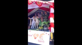 Unexpected halt: parade vehicle sends participants tumbling, laughter ensues