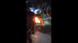 Mobile food vendor's cart catches fire, bystanders help to put out the fire