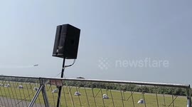 Aerobatics, Andrew Blackwood Murray performs a knife edge at low altitude in his aircraft