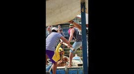 Bad to worse! Frightened pet dog refuses to board boat... then owner carrying him falls into water