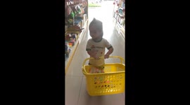 Kate holding the basket in DIY store