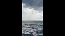 Waterspout 1 mile off the coast of South Beach, Miami Beach, FL