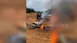 Motocross bike catches fire during off-road race