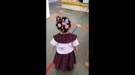 Toddler rocks awesome 'bucket of flowers' hairdo for nursery activity