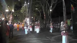 Balancing a rotating object on a big pole (Raban kuchchi dance) and peacock feather dancers attracted the tourist in Sri Lanka cultural show Perahera