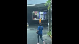 Bottling balance: woman masters the art of balancing a 1.5 liter royal soft drink on her head